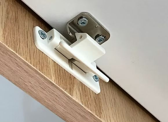 White overhead cabinet latch designed for campervan cupboard doors